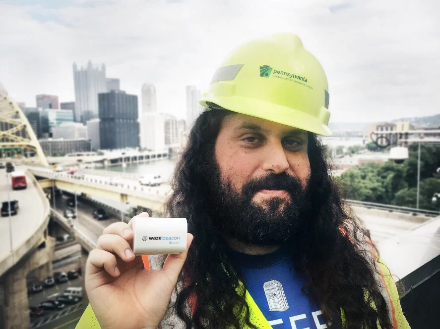 Engineer Gil Disatnik with his Waze Beacon device