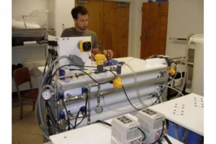 Graduate student Alex Bartman works with the M3 water filtration and desalination system (Photo: UCLA Newsroom)