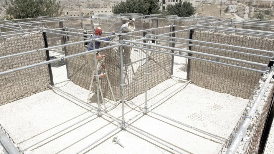 Re:Build's floor is made from plywood panels, and the buildings also have a basic rainwater catchment system