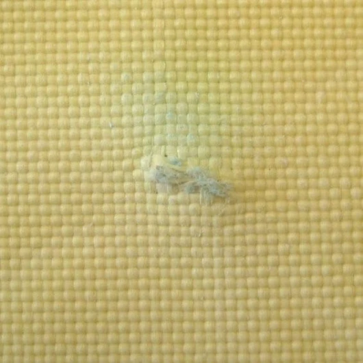 The back of Kevlar fabric soaked in STF after being stabbed with a knife
