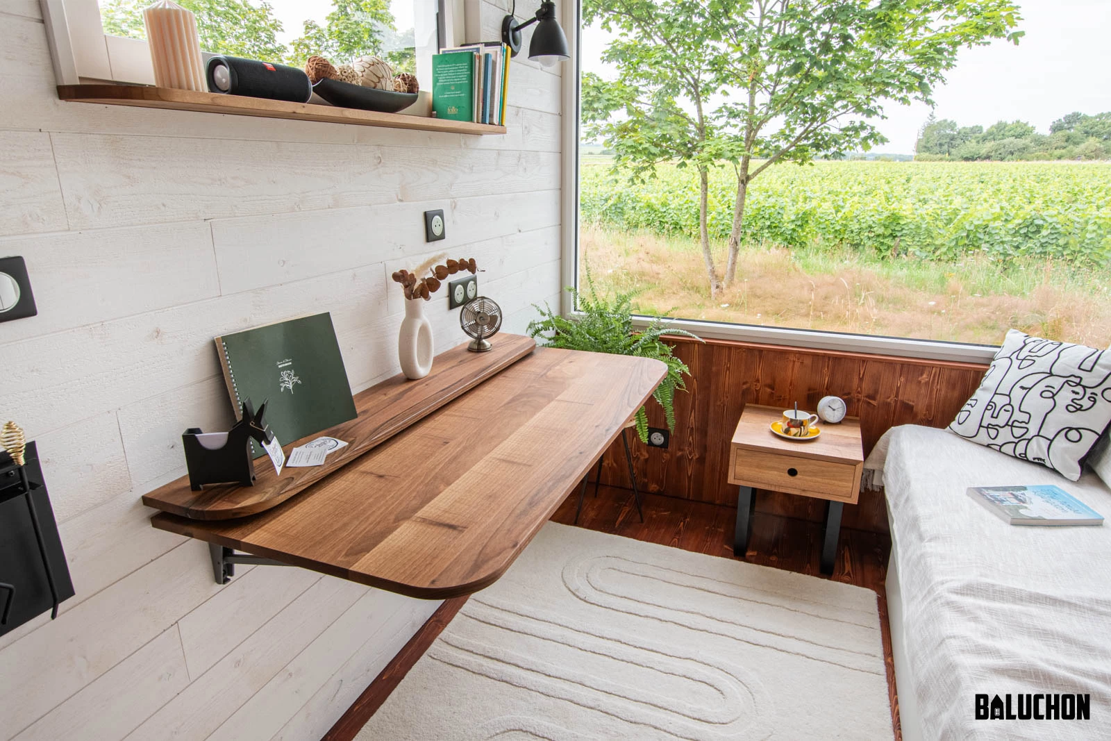The Moulinsart's living room/bedroom includes a folding office desk