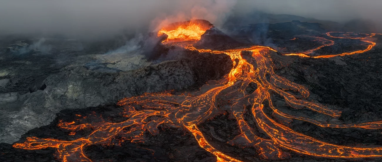 Highly Commended - Nature. Thousands of earthquakes shook the Reykjanes peninsula in an orchestrated prelude to an eruption, until the floor of the Geldigadalir valley gave way to the uncontainable magmatic pressure and split open, letting molten rock gush forth in an awe-inspiring spectacle. Iceland, 2021