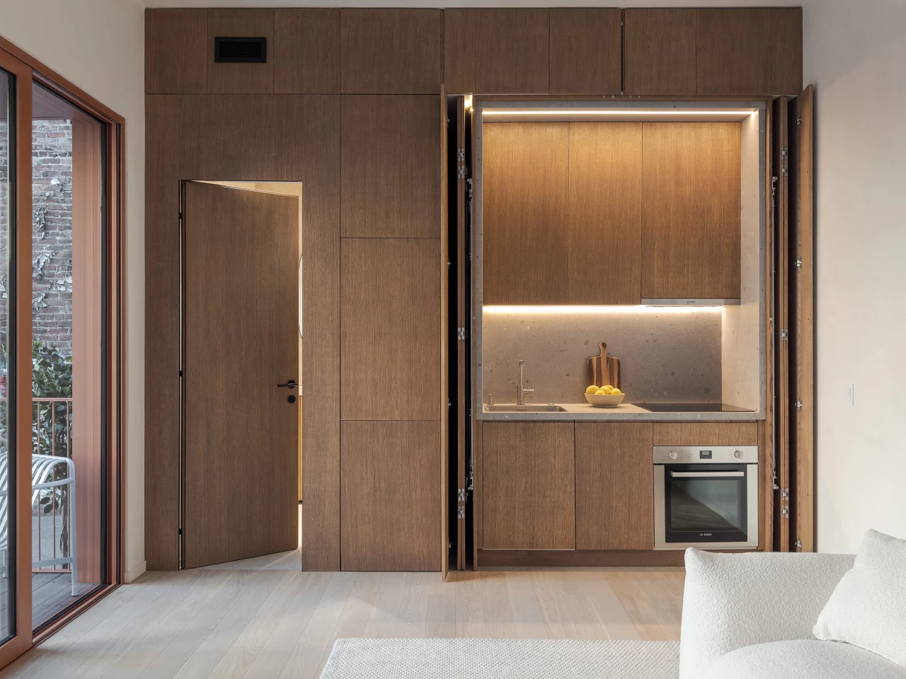 The Cosmic One's kitchen is well-stocked and includes a dishwasher, fridge, oven, induction stove, and sink