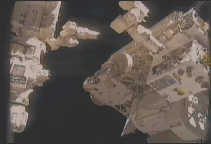 The Canadian Dextre robot approaches the RRM module on the International Space Station during the RRM Gas Fittings Removal task. (Image: NASA)