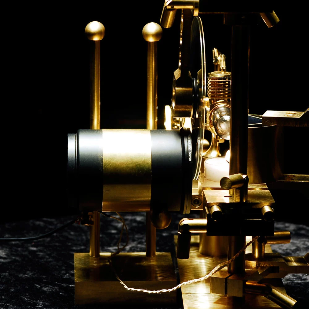 The audio circuit is housed in a black and brass tube that's also home to four photo cells