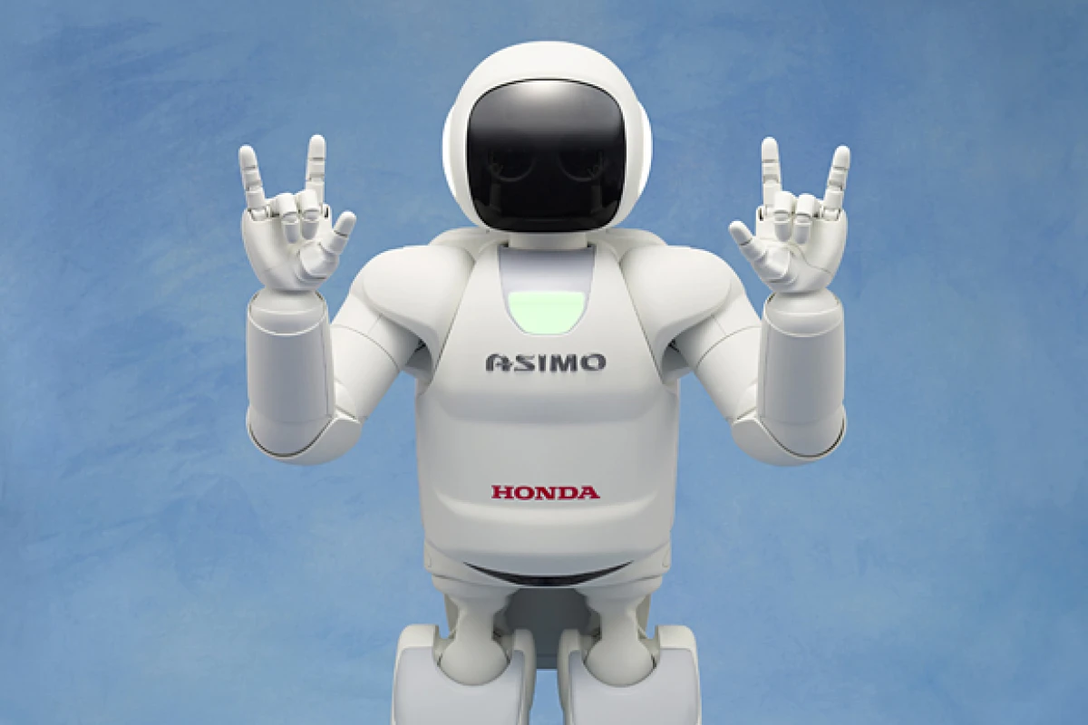 The new ASIMO making the Japanese sign language symbol for "I love you"