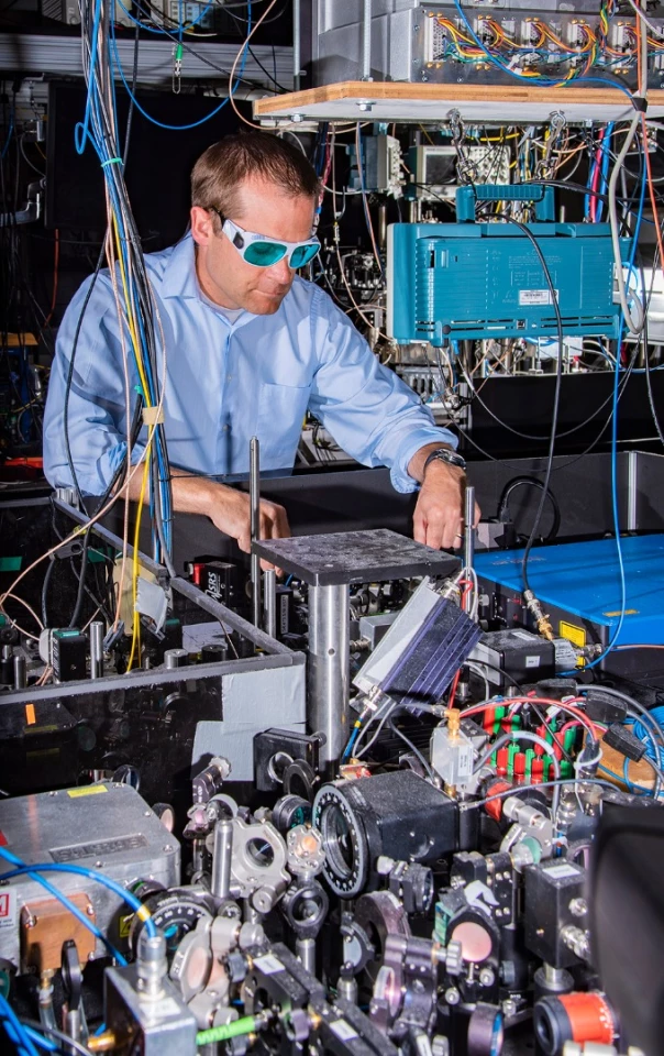 NIST physicist Andrew Ludlow with one of the ytterbium clocks