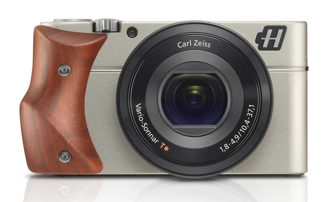 The Hasselblad Stellar is a luxury compact camera modelled on the Sony RX100, pictured with a Padouk Wood hand-grip