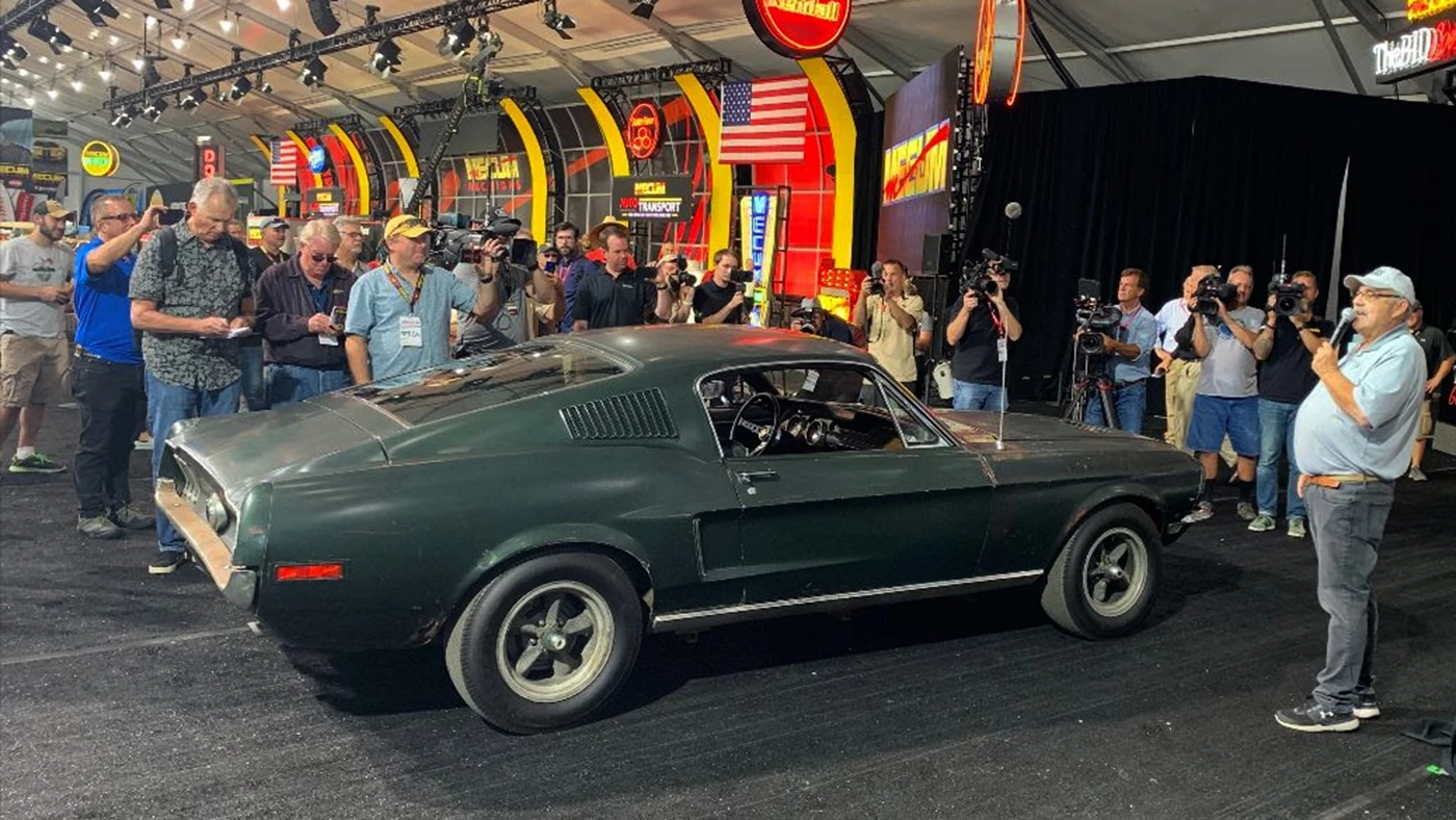 Mecum founder and President Dana Mecum (with microphone) during the announcement of the auction of the car at Mecum's Monterey 2019 auction earlier today