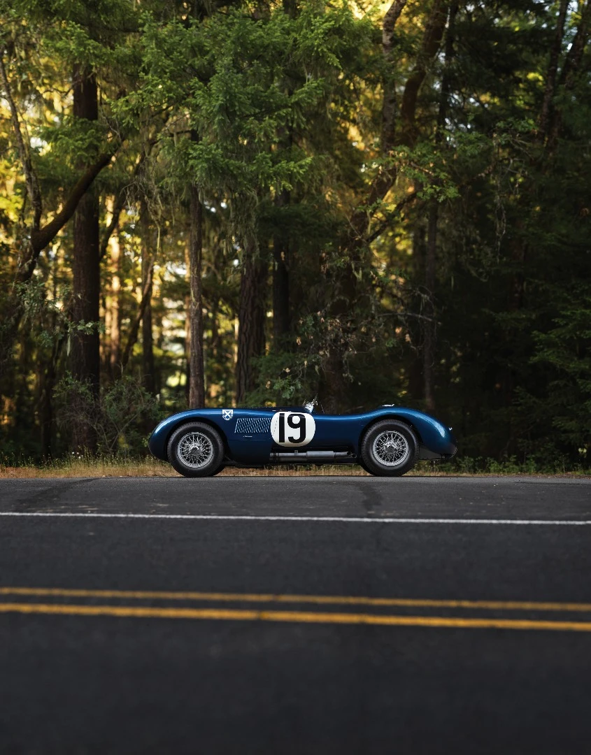 There were just 53 C-Type Jaguars built. Three lightweight works cars (of which this car is one), and a run of 50 cars to satisfy customer demand after the factory cars finished first, second and fourth in the 1953 Le Mans 24 Hour event. The biggest difference to the competition were the disc brakes. Endurance racing was born to demonstrate reliability and validate new automotive technologies for the masses and just as it has done more recently with hybrid and diesel drivetrains, Le Mans heralded the coming of age of a new braking technology with this car and its works siblings. The winning C-type was the first to average more than 100 mph for the 24 Hours of Le Mans (105.8 mph, 170 km/h), and this car, which finished fourth, also broke the ton, averaging 104 mph (167 km/h). Equally at home in any of the world’s finest concours or vintage rallies, this car represents a landmark in Jaguar history.