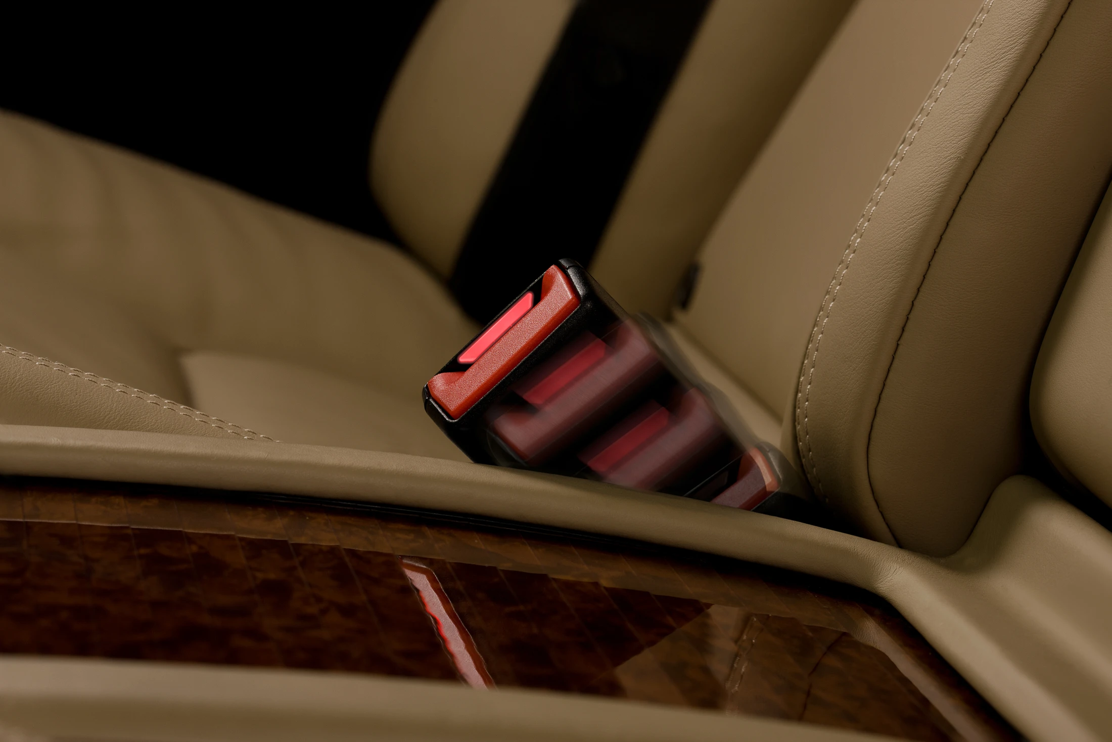 Mercedes' active seat-belt buckle extends from the upholstery when the rear door is opened