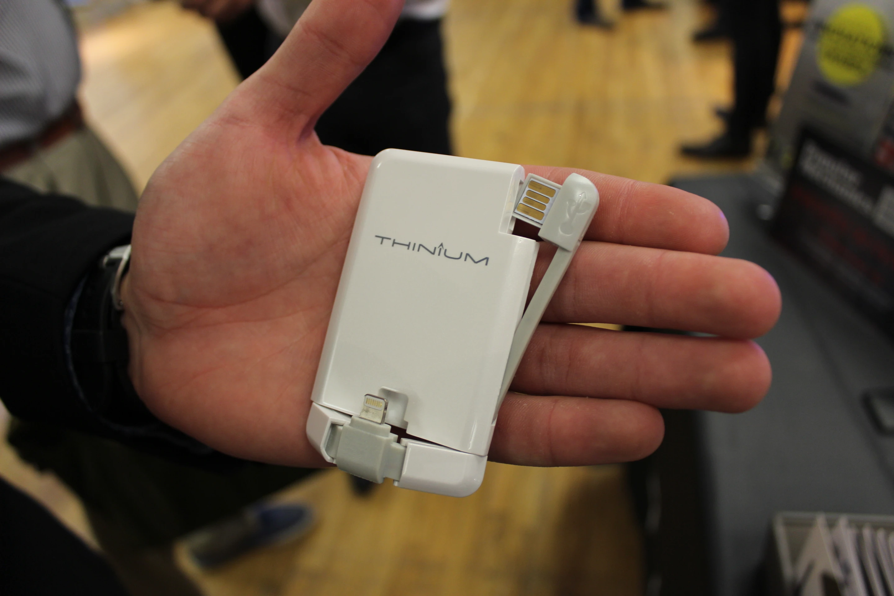 The Thinium Charge with its Lightning plug and USB dongle extended