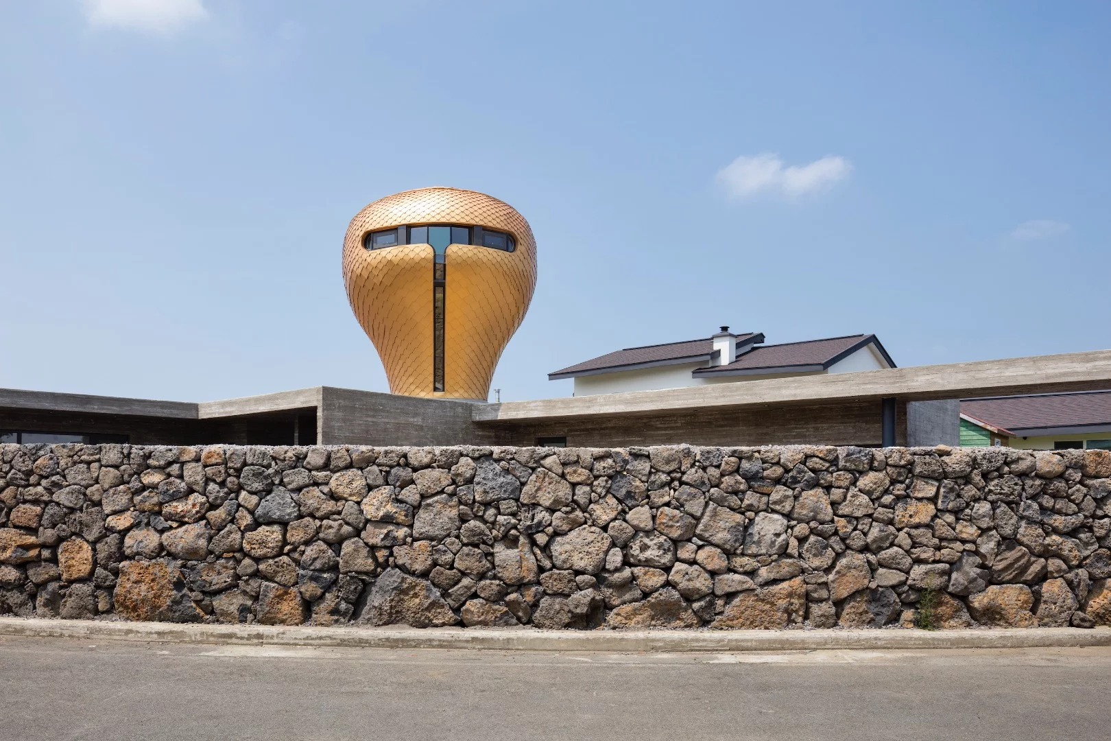 The golden structure rises to a height of 8.3 m (27 ft)