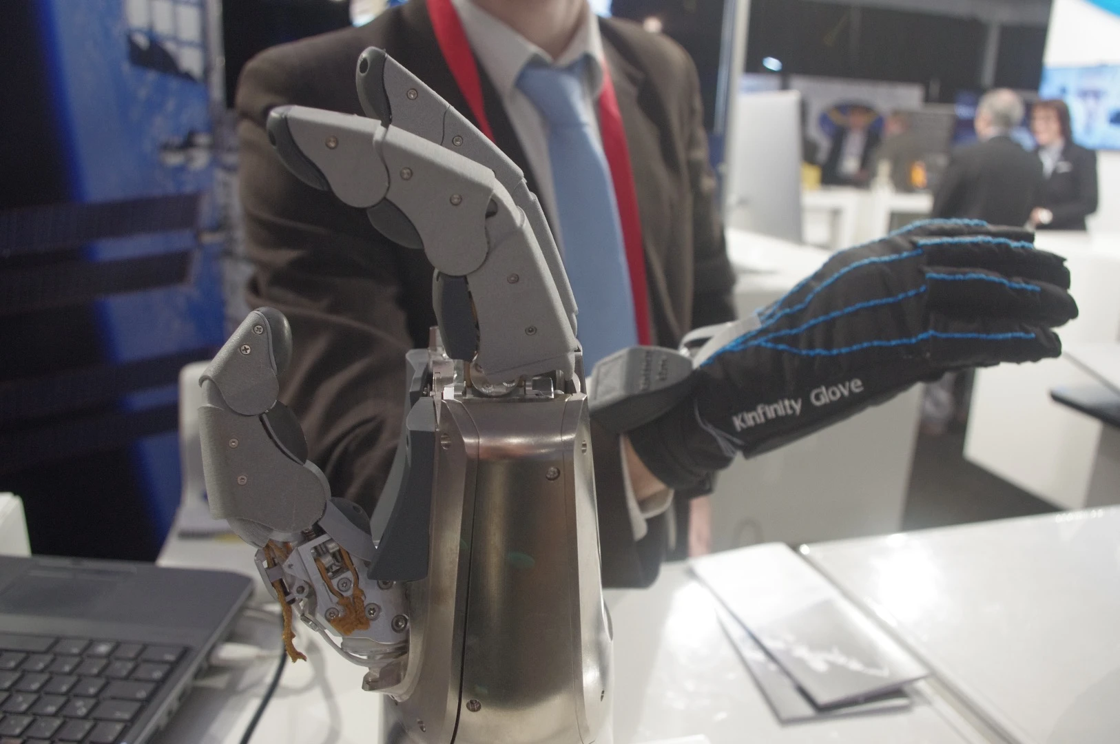 Also on exhibit at the German Aeropsace Center (GAC) booth was this robotic "Spacehand" and "Kinfinity" glove. The hand is designed to be controlled in a natural way by the wearer of the glove and can help with delicate maneuvers on spacecraft in orbit. The robotic hand and the arm to which it attaches has sensors in all the joints that provides it constant feedback on the force it is applying. GAC's Maxime Chalon said that in addition to helping astronauts on the ISS do fine inspection and repair maneuvers, the system could also help snag space debris. "If you think about catching satellites or debris that is tumbling, you can check with the manufacturer and find out how much you can press on various parts of the equipment," he told us. "You set that in the robotic system and say, 'OK, let's go there, grab it, apply as much pressure as you can, and if anything comes to close to the limit, just let go.'"