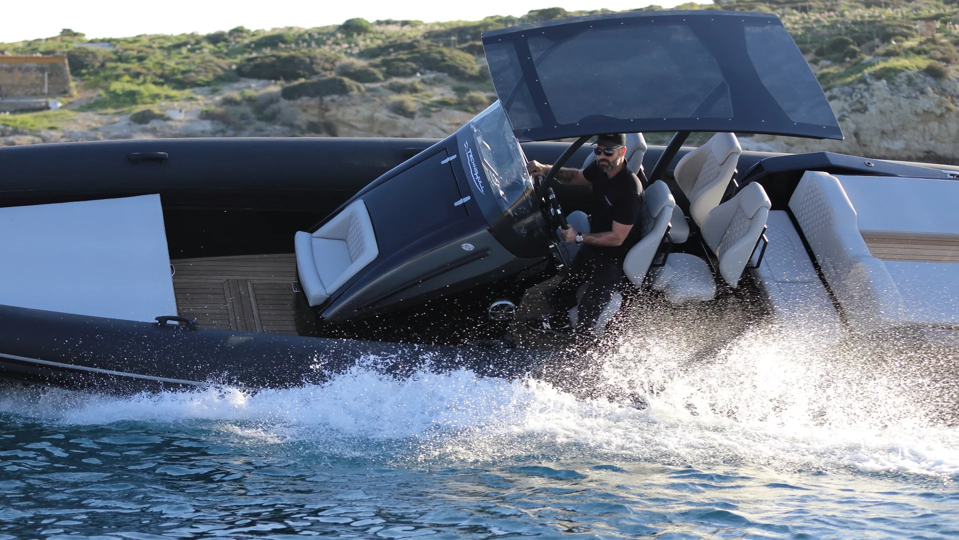 We're assuming the sunbathers on the back of the Technohull Sea DNA were dropped off at the shore before these shots were taken