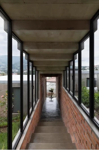 The glass windows capture the striking views towards the Ilalo volcano