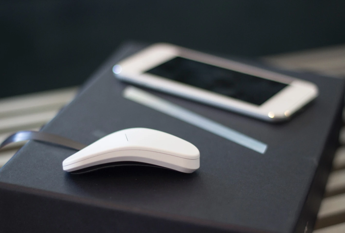 Thync device (foreground), with a paired iPod touch sitting behind it