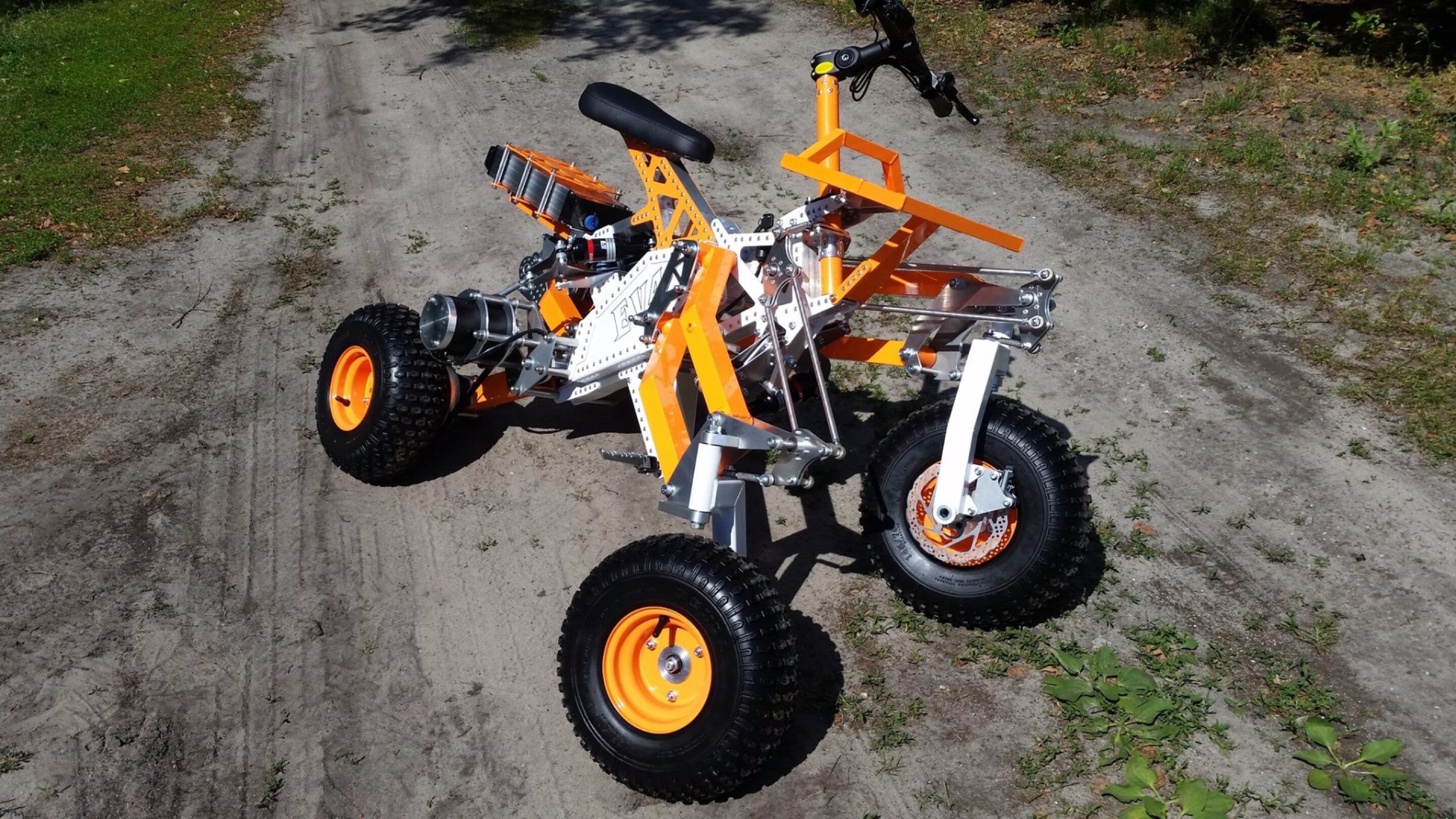 Tilting electric quad gets menacing offroad big brother