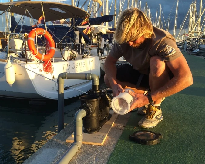 The Seabin is installed on a dock and plumbed into a shore-based water pump