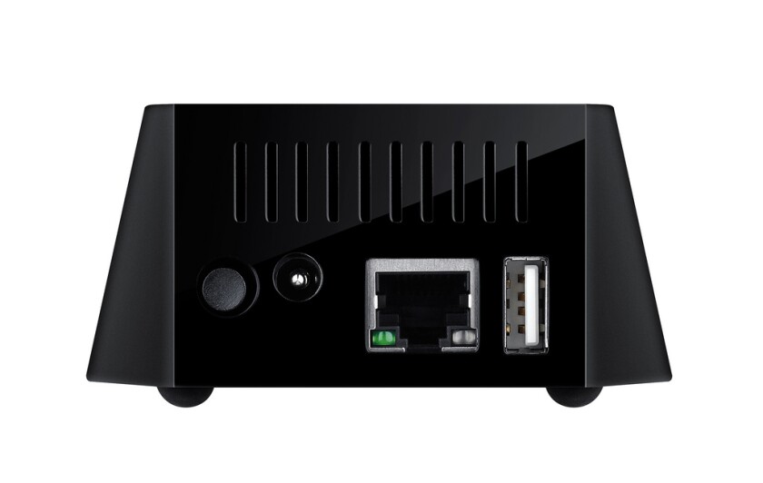To the rear of the base are two connection ports and a power socket