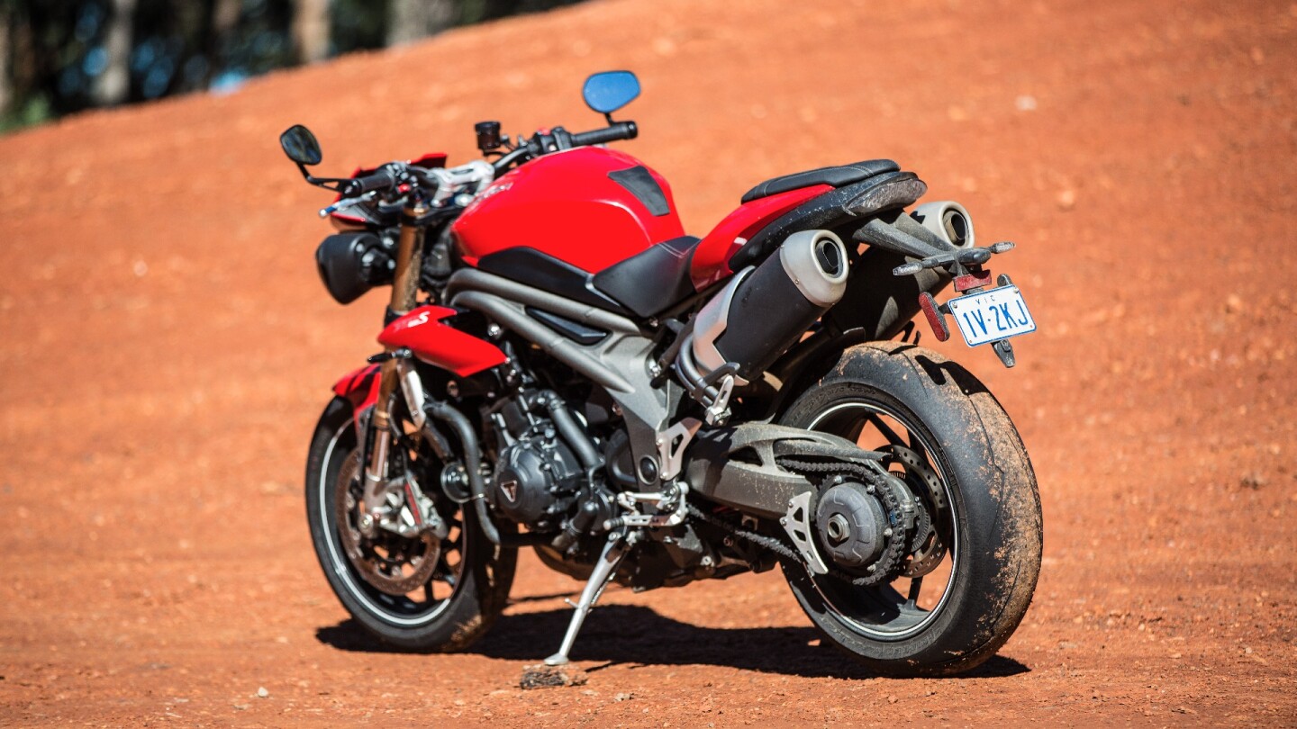 Triumph Speed Triple S: twin underseat pipes are another fashion statement that plays poorly on the road. They're a large mass of metal high and wide, and they do the opposite to mass centralization