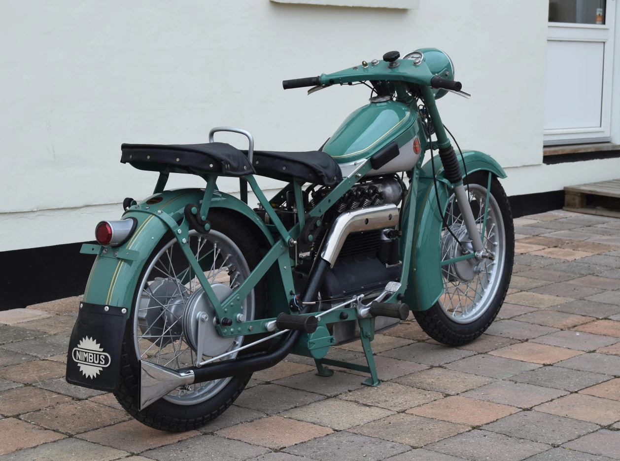 Produced as a sideline by Danish vacuum cleaner manufacturer, Fisker & Nielsen, the Nimbus 750 first appeared in 1919, and was produced in limited quantities until 1954, with only a few bikes produced after 1954 by assembling spare parts. There were several of these remarkable machines sold at Stafford with the above machine being one of the last produced (1953) and the equal most expensive of the group at just $12,000 - a pittance considering the astonishing work performed in restoring the bike to new condition at Aarhus Nimbus in Denmark. Just 12,000 were produced during the four decade production run, with more than 4000 still registered and active in Denmark, and many more coveted in other countries. The ability to purchase a machine of such technological excellence, rarity and near perfection for four figures is astonishing. Other Nimbus fours on offer at Stafford included 1938, 1939 and 1948 models. Auction Description
