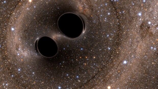 An artist's rendering of the two black holes that collided to produce the gravitational waves detected on Earth