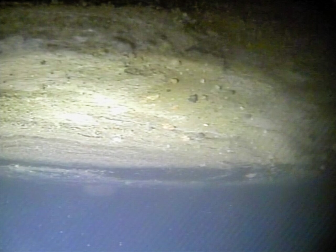 Thwaites' ice is speckled with sediments and rocks at the glacier's grounding zone