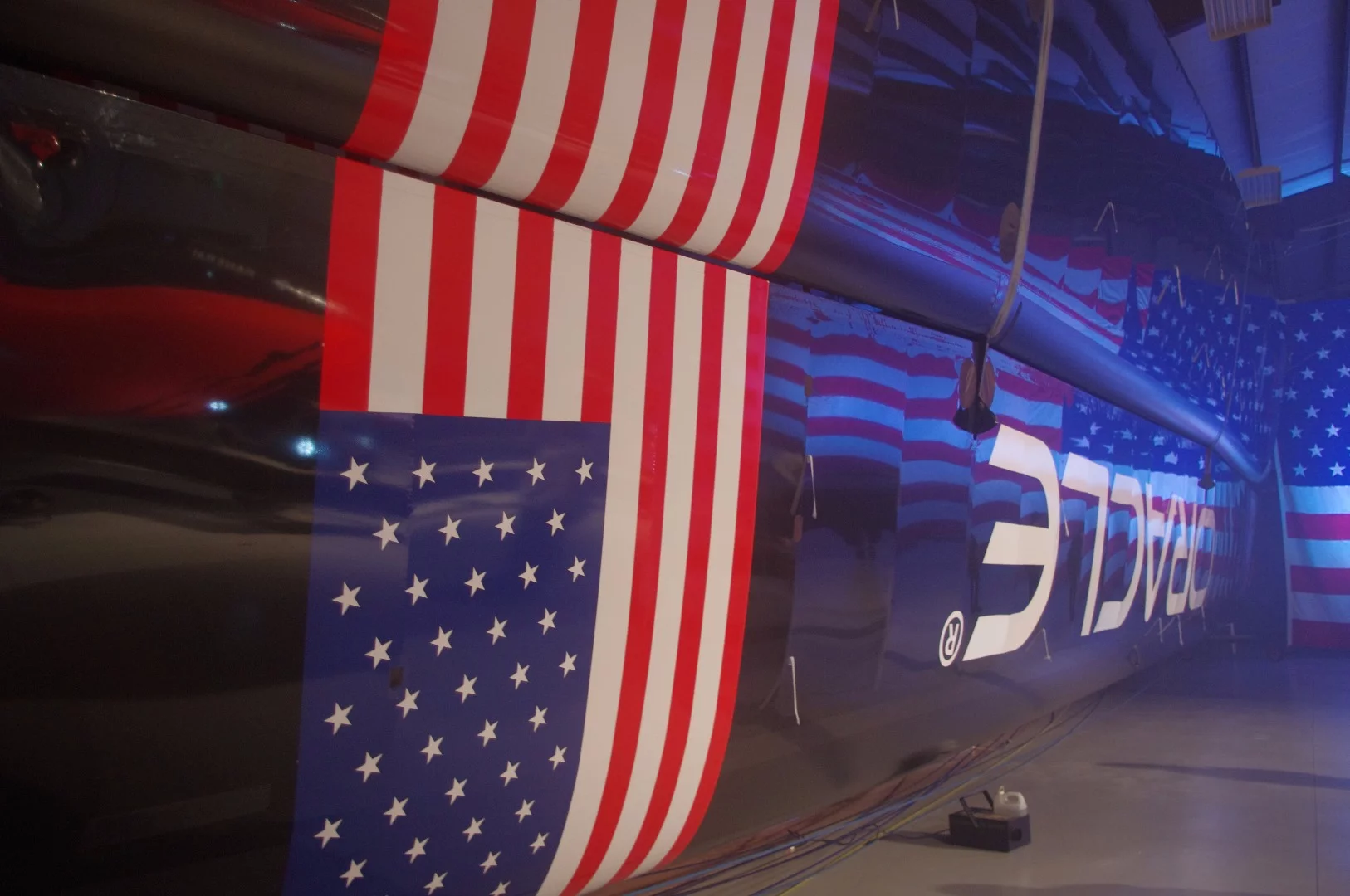 The yacht's sail (known as a wing) stored on its side in the warehouse. It resembles the wing of the Airbus A320.