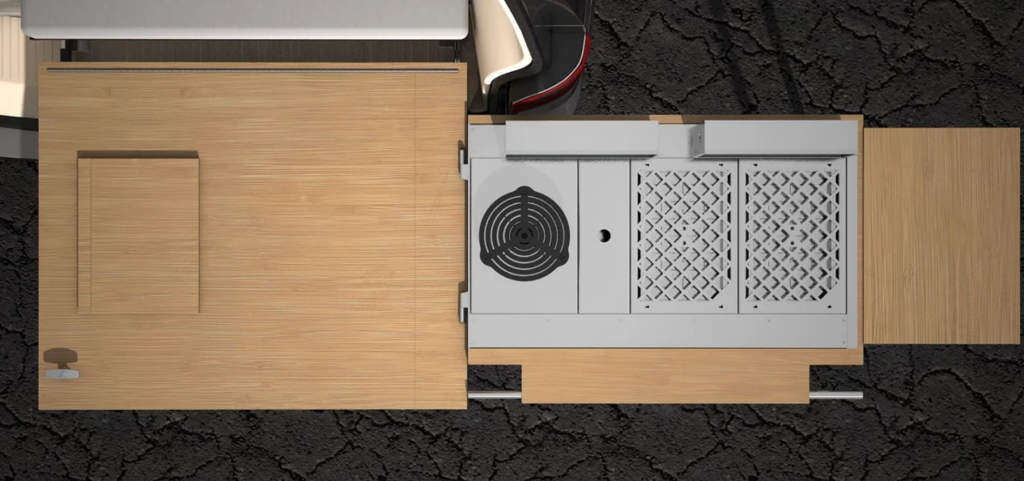 Calicamp with two charcoal grills, a gas burner, a slim storage bin, windscreens and the extension worktop attached
