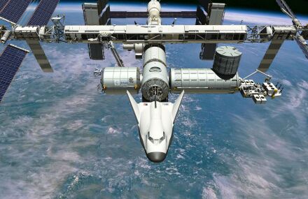 Rendering of Dream Chaser visiting the ISS