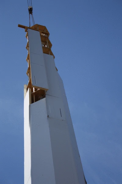 Glued laminated timber panels fit together to form a hollow tower