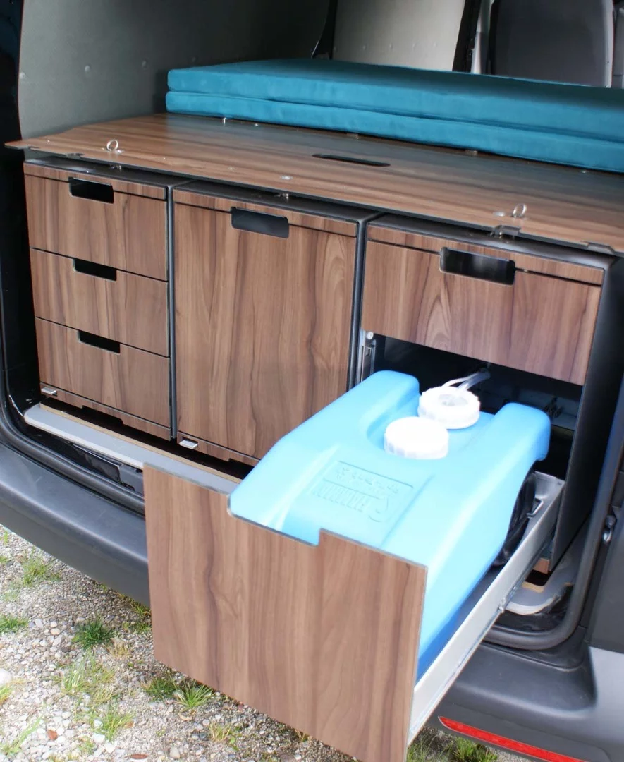 The wash module houses a 23-liter water tank