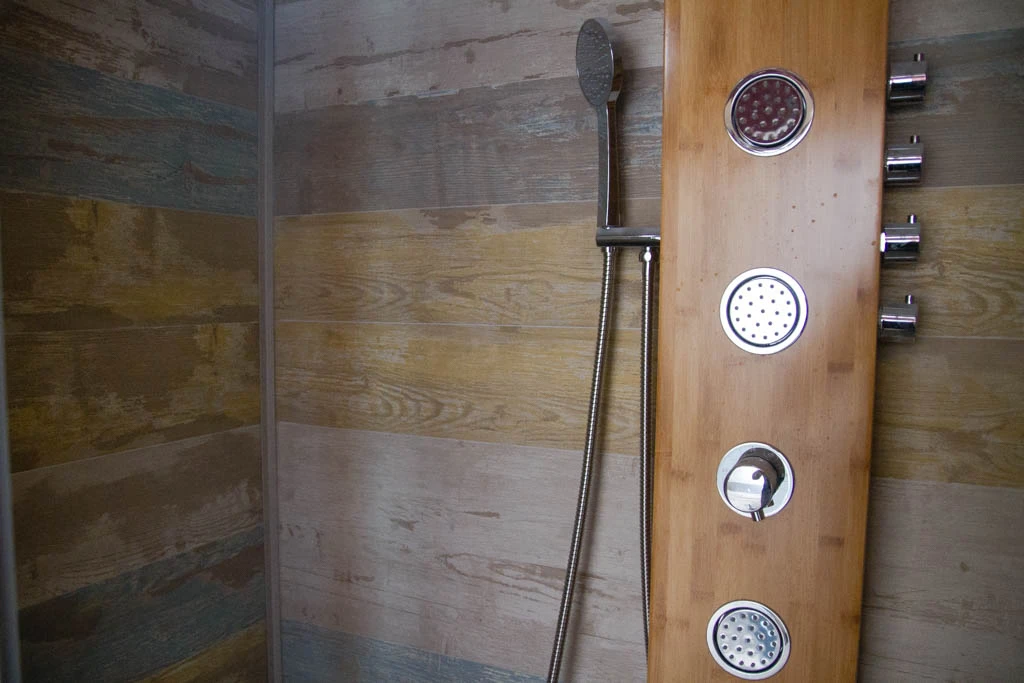 Some might miss having a bathroom attached to their room, but the Truck Surf Hotel does have a shared bathroom onboard for guests