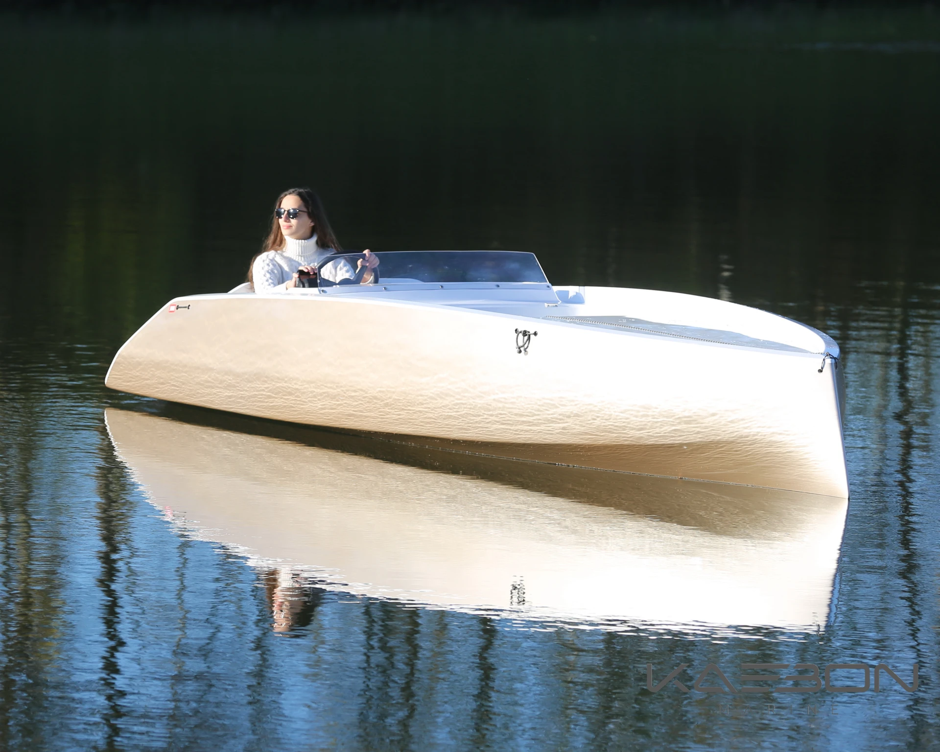 Carbon fiber electric boat is so light it rides to water on a car roof