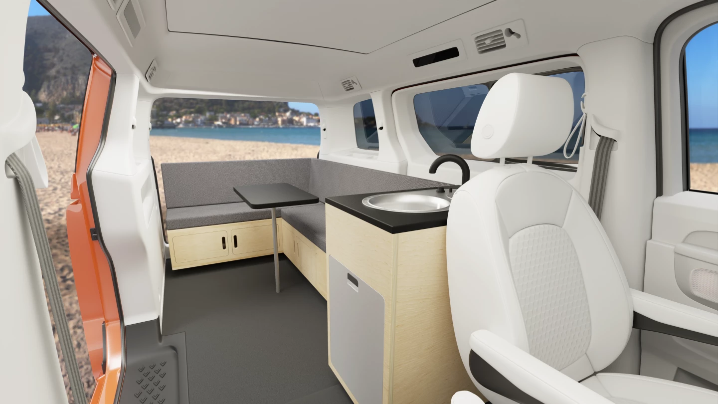 We're not sold on the tiny kitchen or single-burner stove, but the roomy L-shaped sofa dining lounge looks like a nice place to spend time