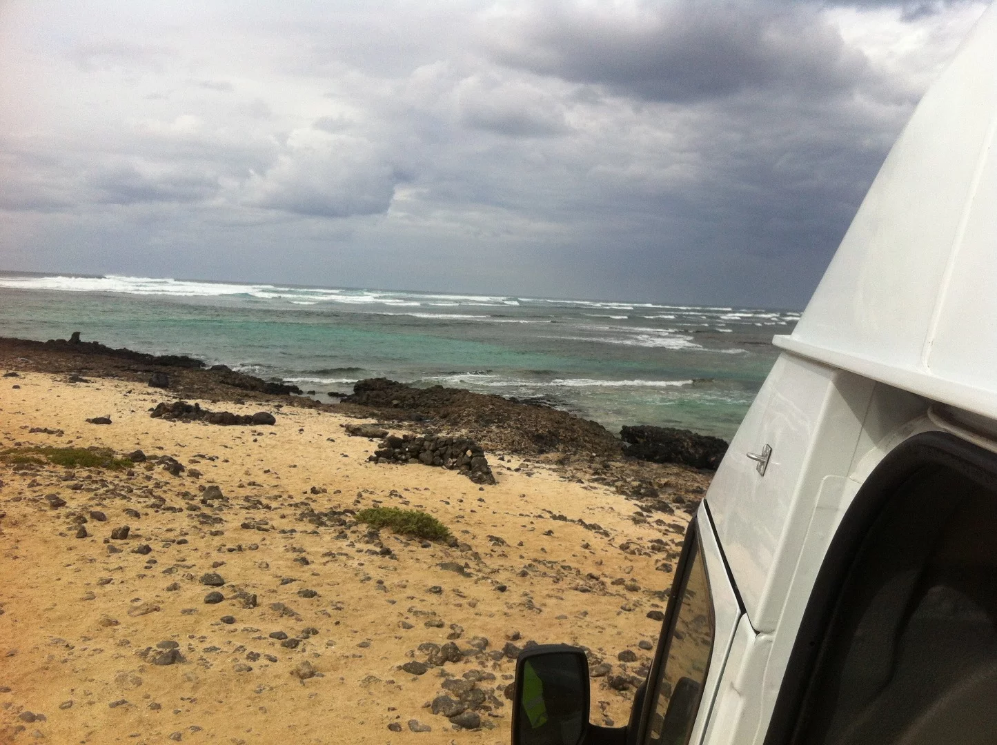 The van was designed as a work/play, wave-chasing stealth camper