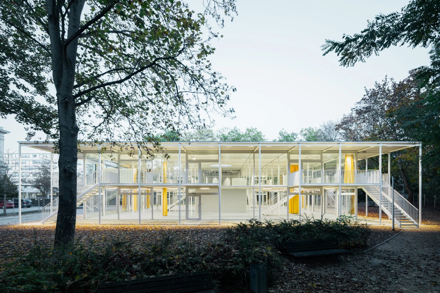 The pavilion has an indeterminate ground floor and a first floor consisting of a series of platforms and bridges that extend into the exterior.
