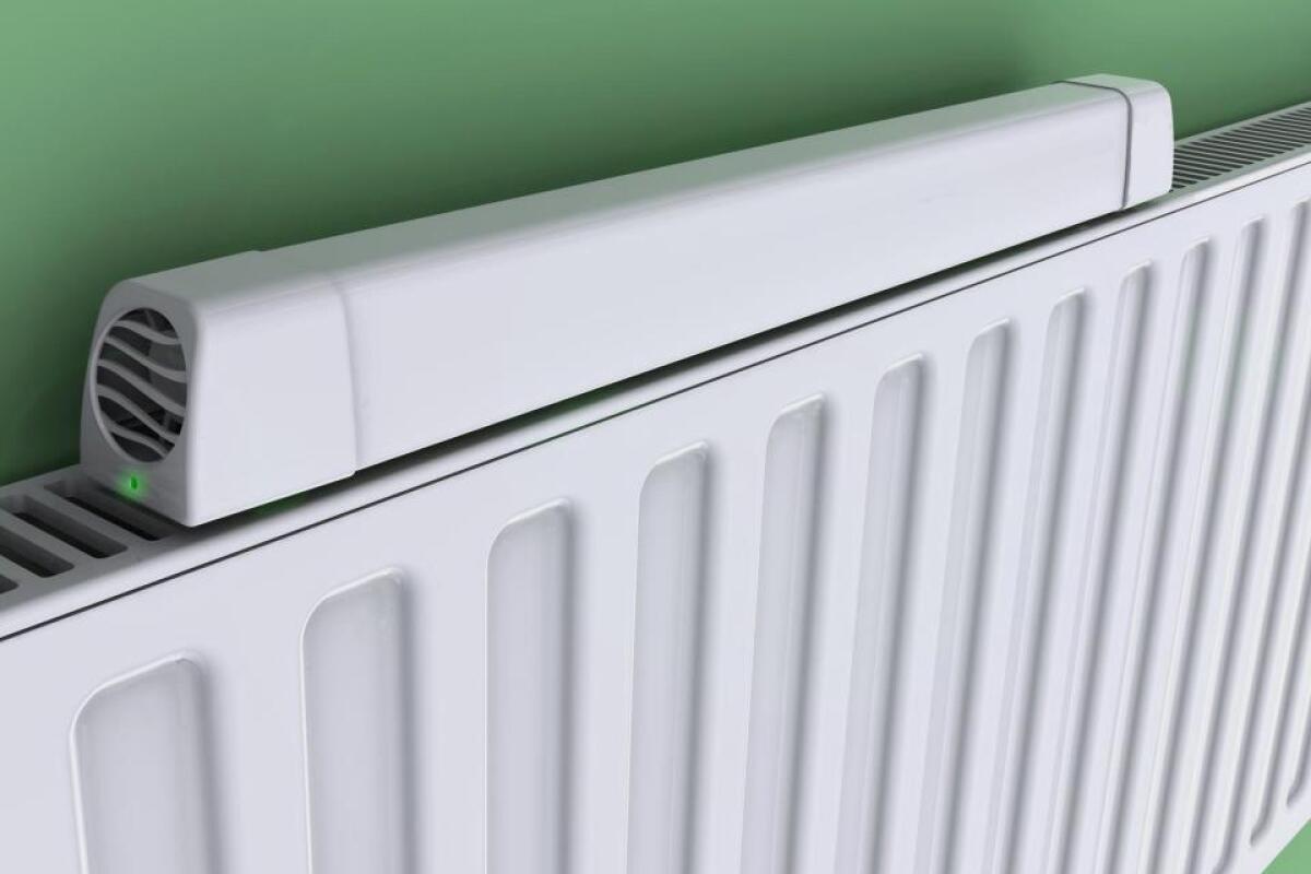 The Radiator Booster is a temperature-activated fan, that draws warm air out from behind a radiator and into the room