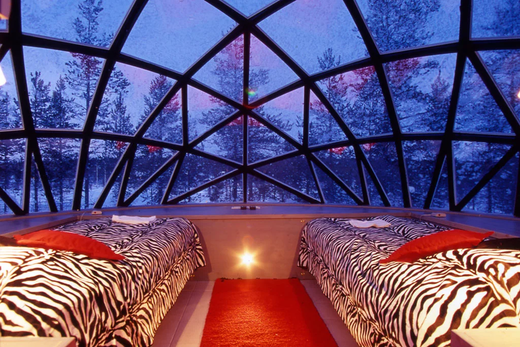 Inside a glass igloo twin room (image from Hotel Kakslauttanen)