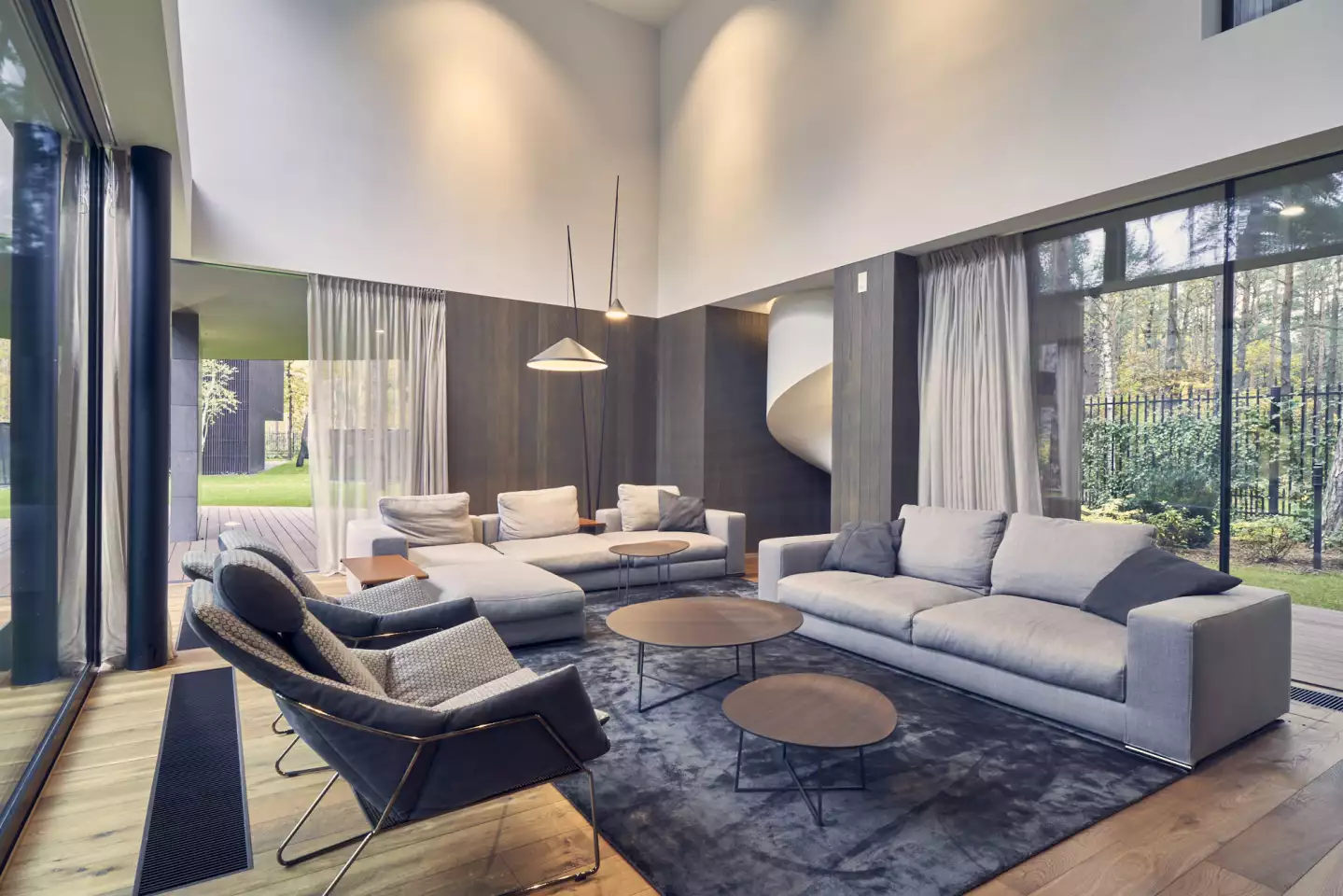 Circle Wood's interior includes high ceilings and features lots of glazing to maximize the views of the forest