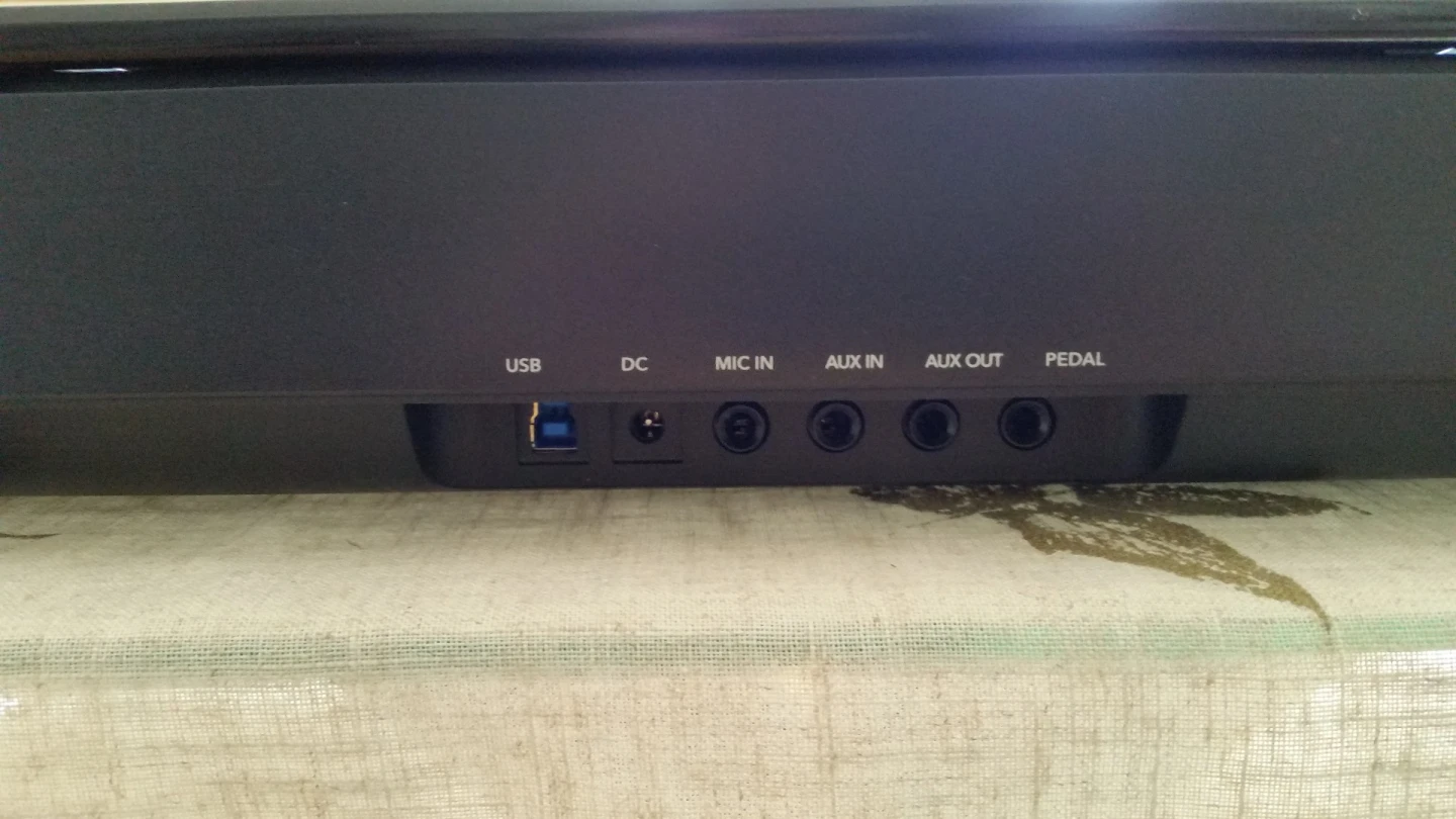 The back of the One Smart Light piano with multiple plug-ins