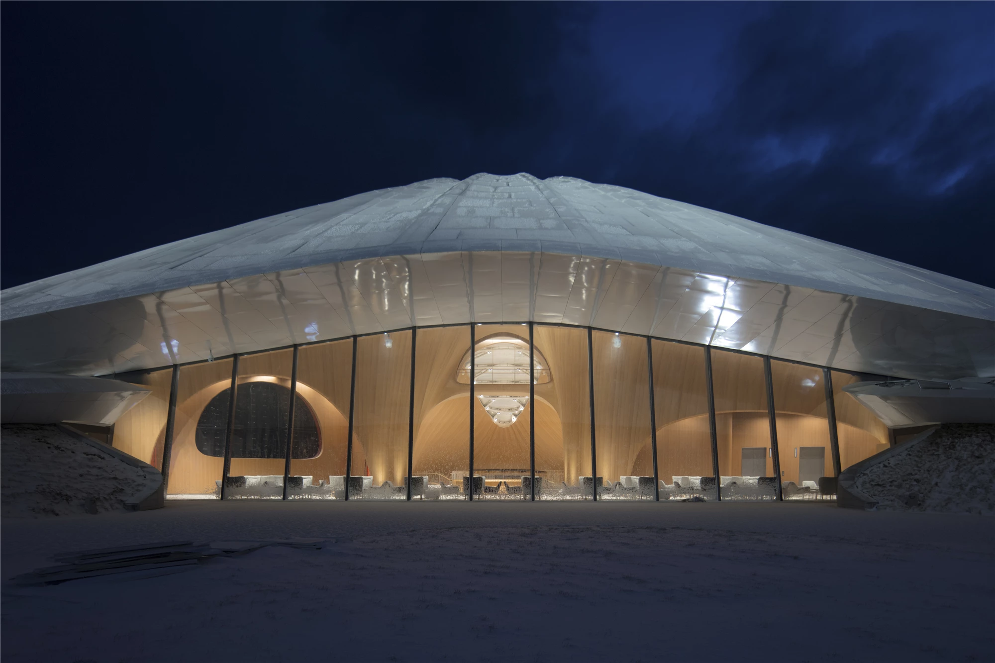 The Yabuli Entrepreneurs' Congress Center features a partially transparent facade to maximize natural light inside