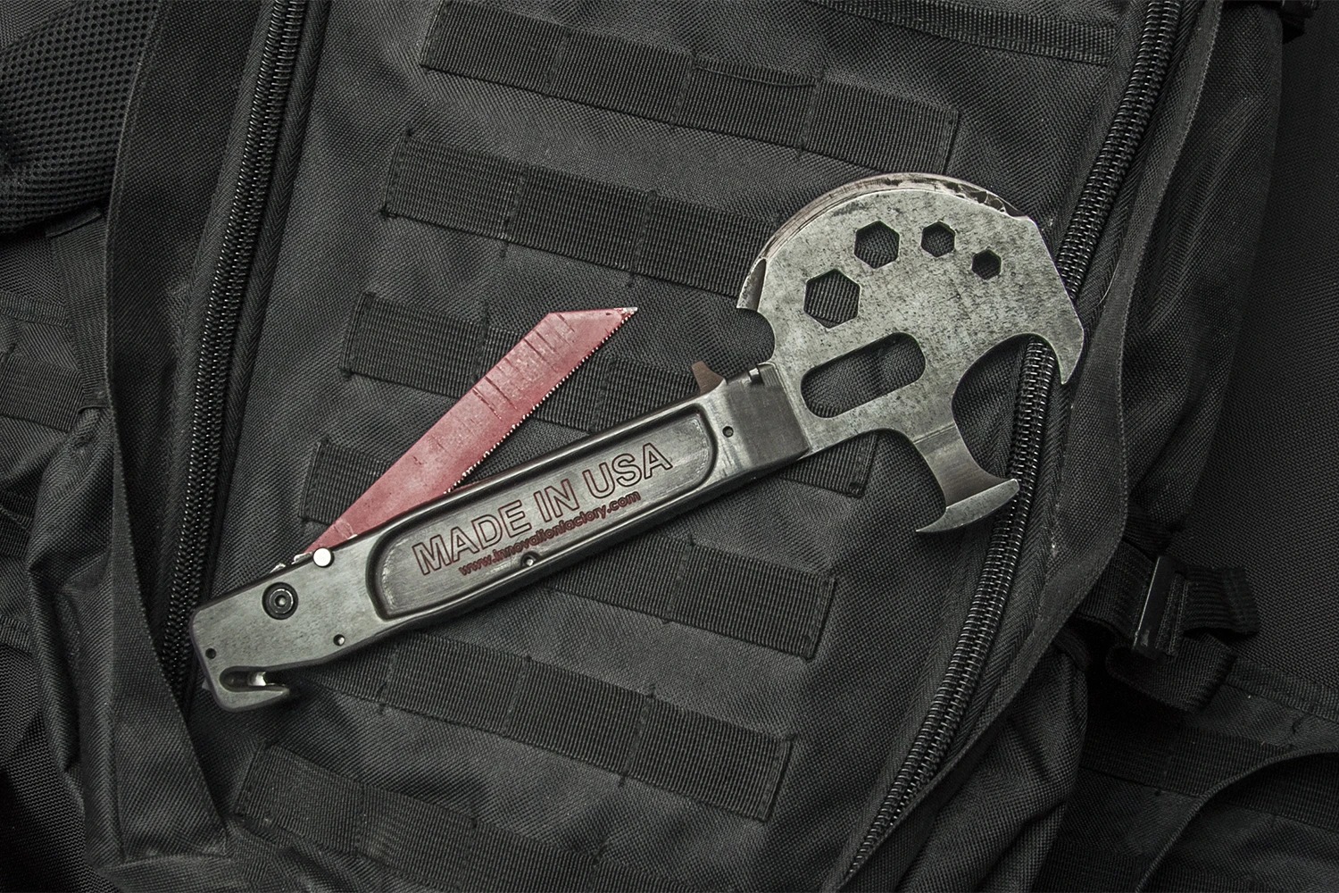 The Lil Trucker multitool includes an extendable saw for cutting through wood