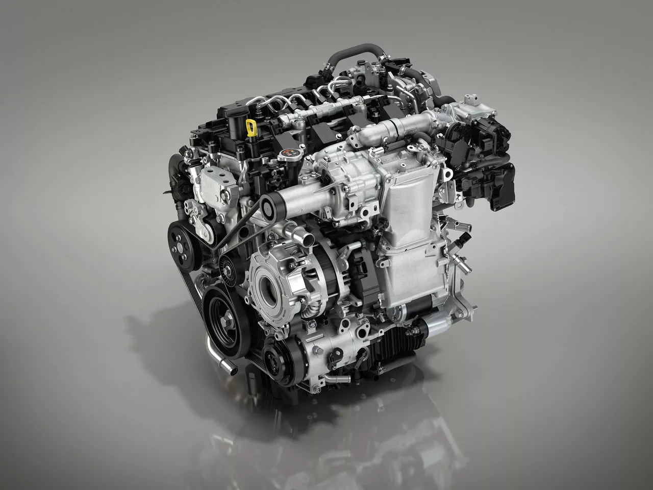 The Skyactiv-X runs at high compression with an HCCI design that includes pre-ignition spark for control of cylinder compression