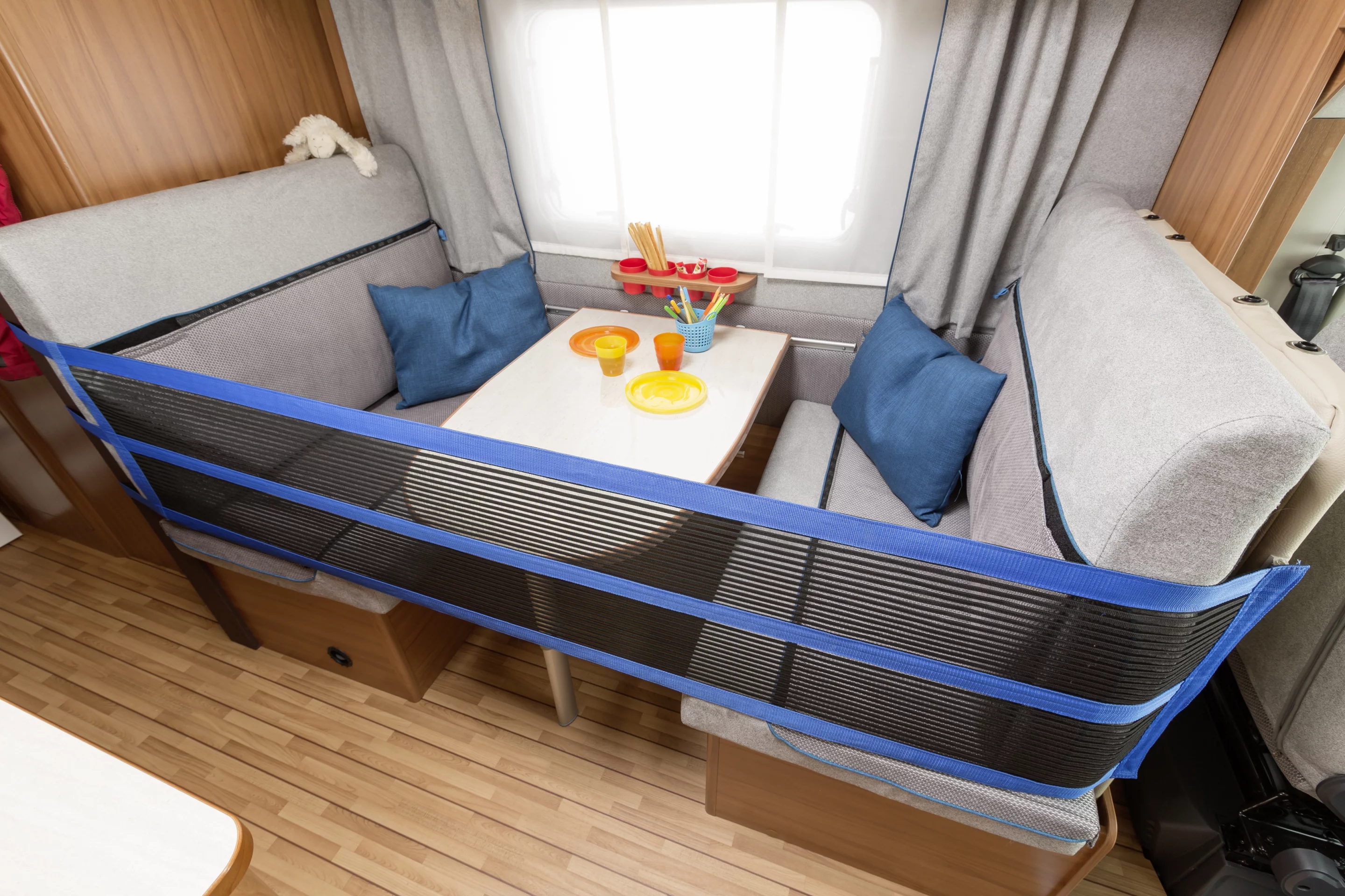 The convertible dining set is updated with safety netting, removable fabric and a cupholder unit