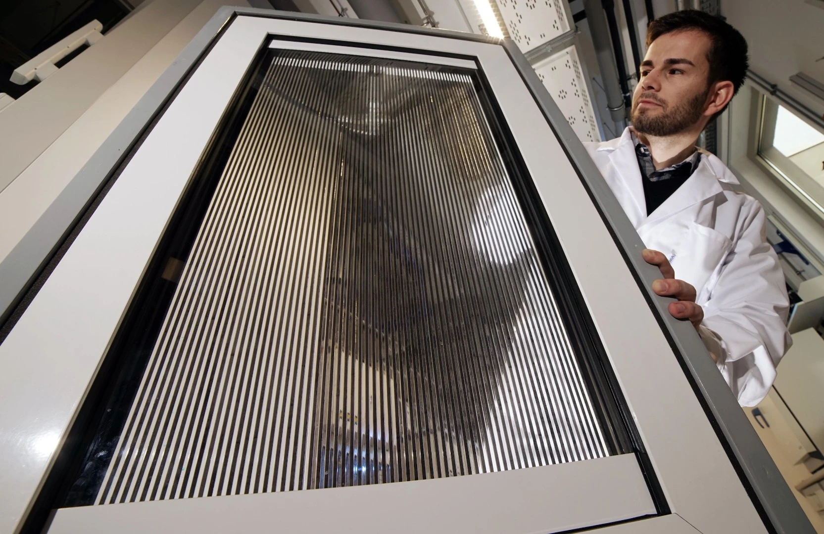 A prototype of the Large-Area Fluidic Windows, which can control shade and harvest heat using magnetic nanoparticles suspended in liquid