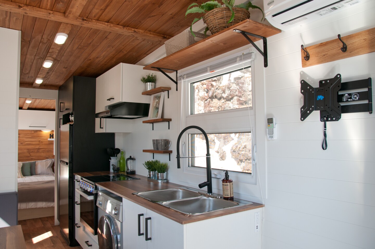 The Nomad's kitchen includes a propane-powered stove, an oven, and washer/dryer