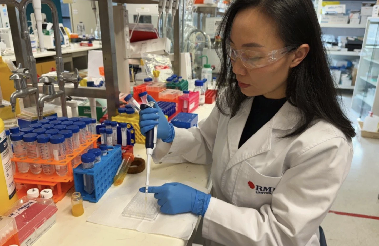 Nguyen preparing treatments to test in the RMIT lab