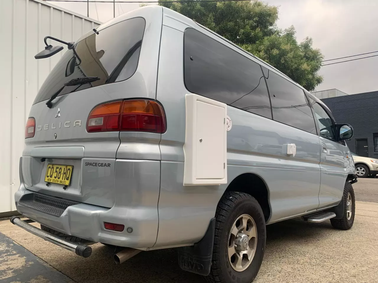That white access hatch is rather clunky, but the rest of the conversion makes for a rather attractive, little camper
